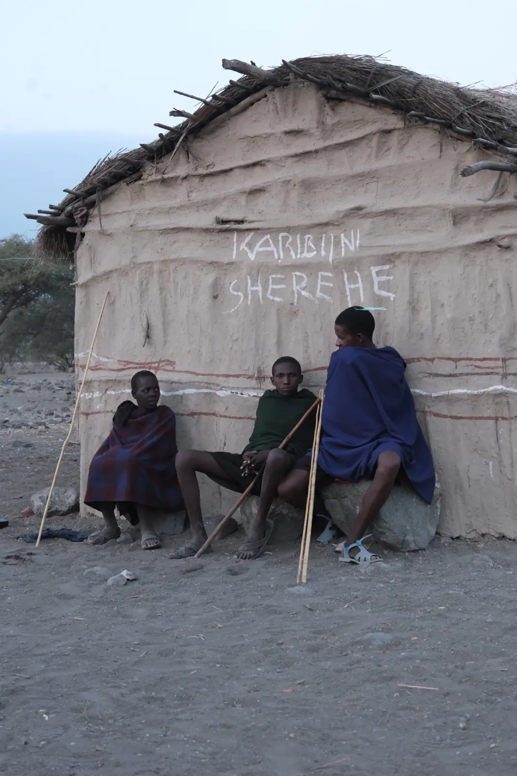 A bench and shaded wall outside a building near Lake Natron.